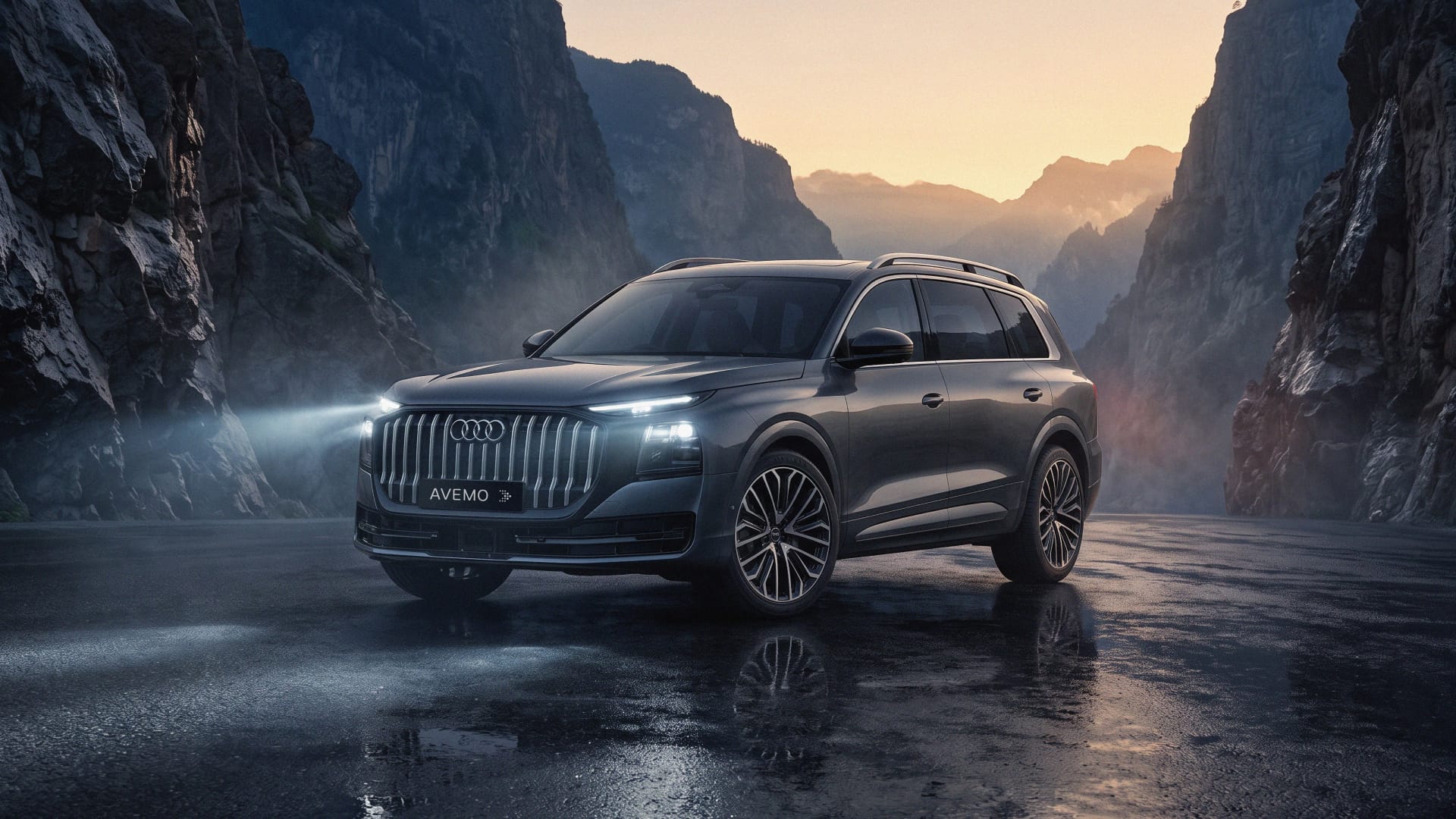 Der neue Audi Q9 mit angeschalteten Scheinwerfern vor einer Bergschlucht